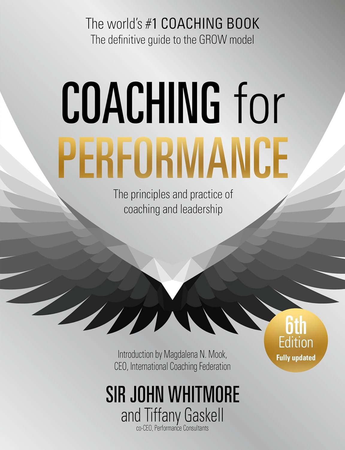 Book cover of 'Coaching for Performance' with wings and text on a gray background
